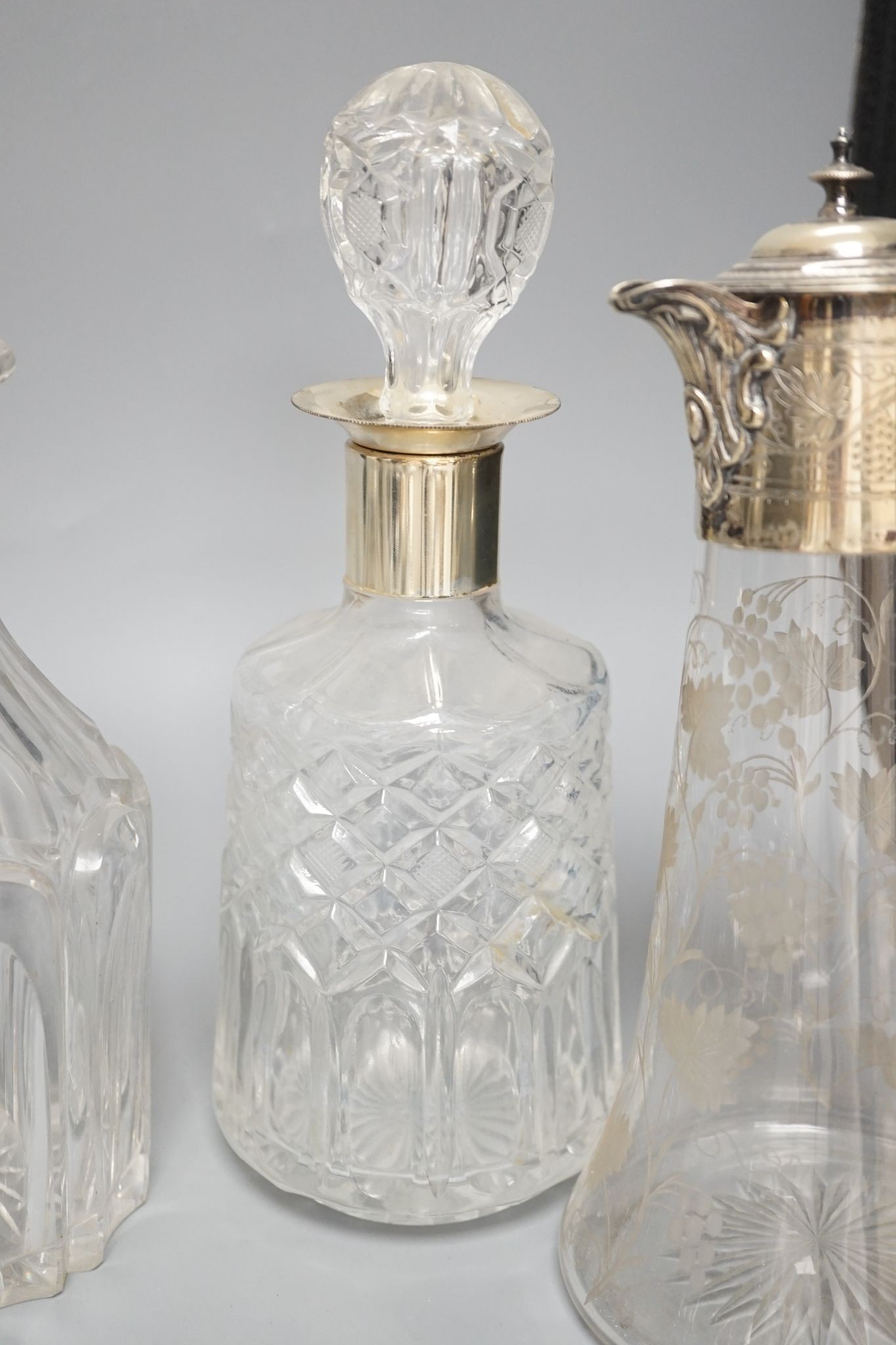 A Hukin and Heath claret jug and other decanters etc.